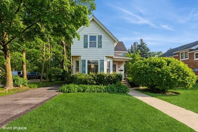 940 W Main St, Saint Charles, IL 60174 - view of front facade featuring a front lawn