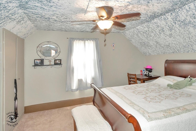 carpeted bedroom with baseboards, ceiling fan, and lofted ceiling