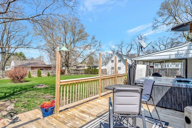 wooden deck featuring a yard and fence private yard