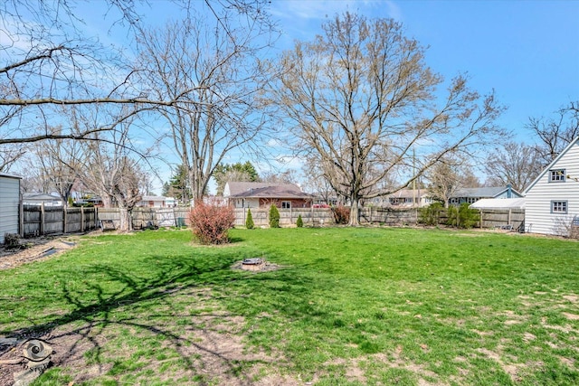 view of yard with a residential view and a fenced backyard