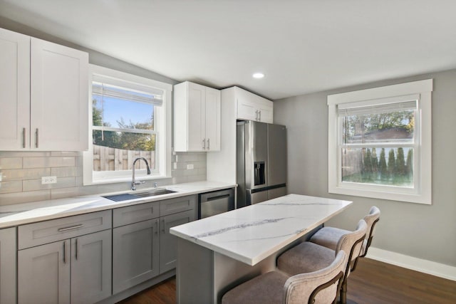6734 N Hamlin Ave, Lincolnwood, IL 60712 - kitchen featuring a sink, stainless steel appliances, decorative backsplash, healthy amount of natural light, and recessed lighting