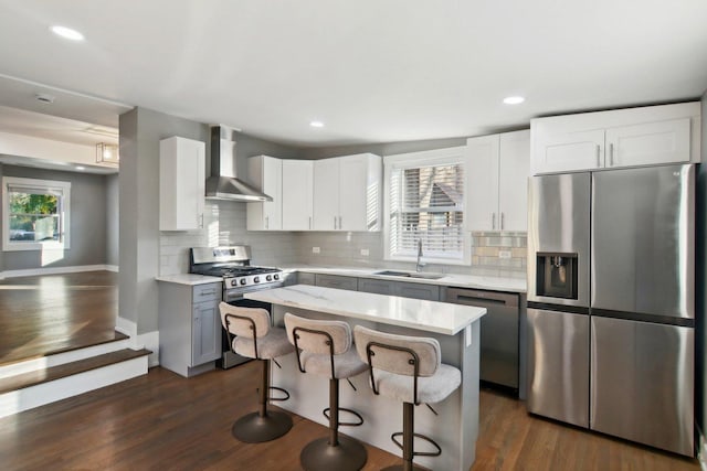 6734 N Hamlin Ave, Lincolnwood, IL 60712 - kitchen featuring stainless steel appliances, wall chimney exhaust hood, a sink, decorative backsplash, and recessed lighting
