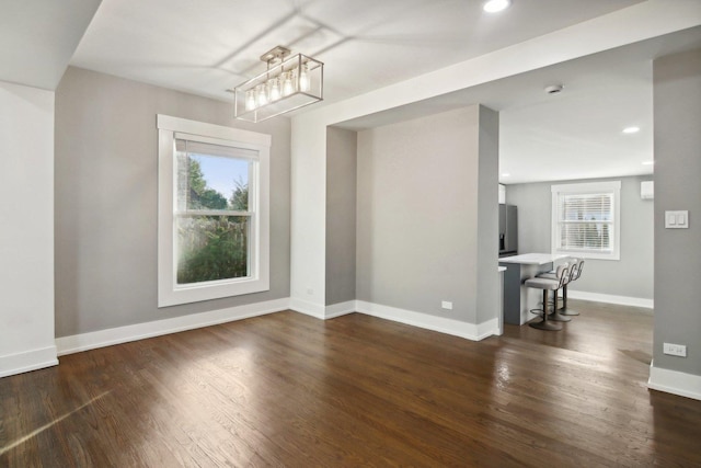 6734 N Hamlin Ave, Lincolnwood, IL 60712 - unfurnished dining area featuring plenty of natural light, dark wood-style floors, a chandelier, recessed lighting, and baseboards