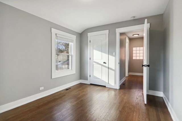 6734 N Hamlin Ave, Lincolnwood, IL 60712 - unfurnished bedroom with dark wood finished floors and baseboards