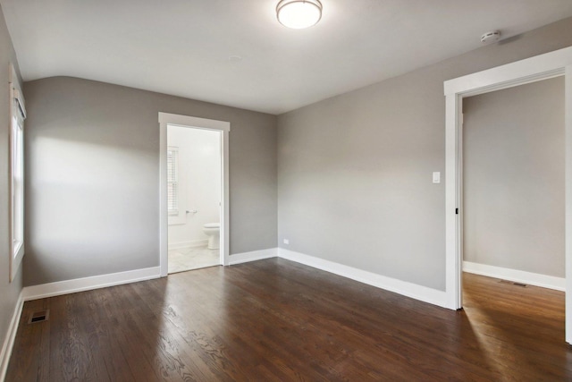 6734 N Hamlin Ave, Lincolnwood, IL 60712 - empty room featuring a smoke detector, wood finished floors, baseboards, and lofted ceiling