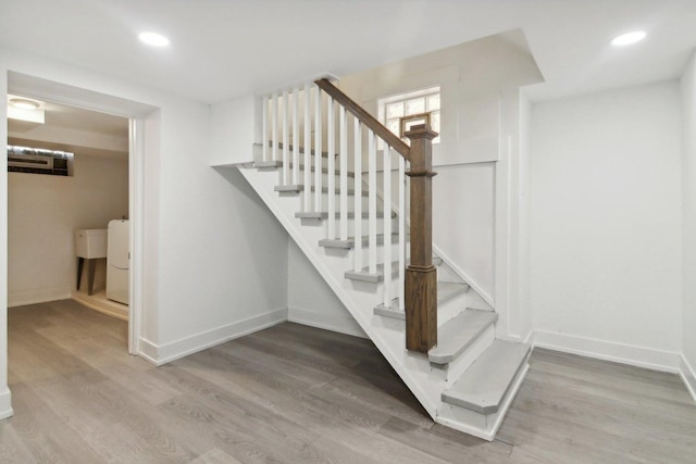 6734 N Hamlin Ave, Lincolnwood, IL 60712 - stairway with wood finished floors, baseboards, and recessed lighting