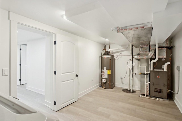 6734 N Hamlin Ave, Lincolnwood, IL 60712 - finished basement featuring gas water heater, wood finished floors, baseboards, and heating unit