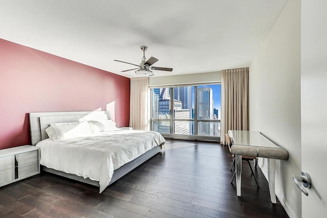 bedroom with dark wood-style floors, access to exterior, and ceiling fan