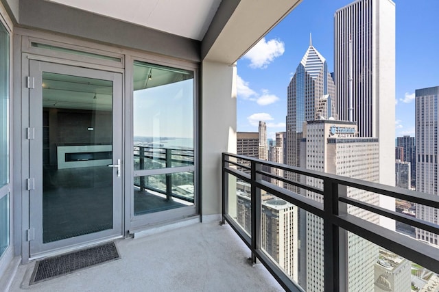 balcony with visible vents and a view of city