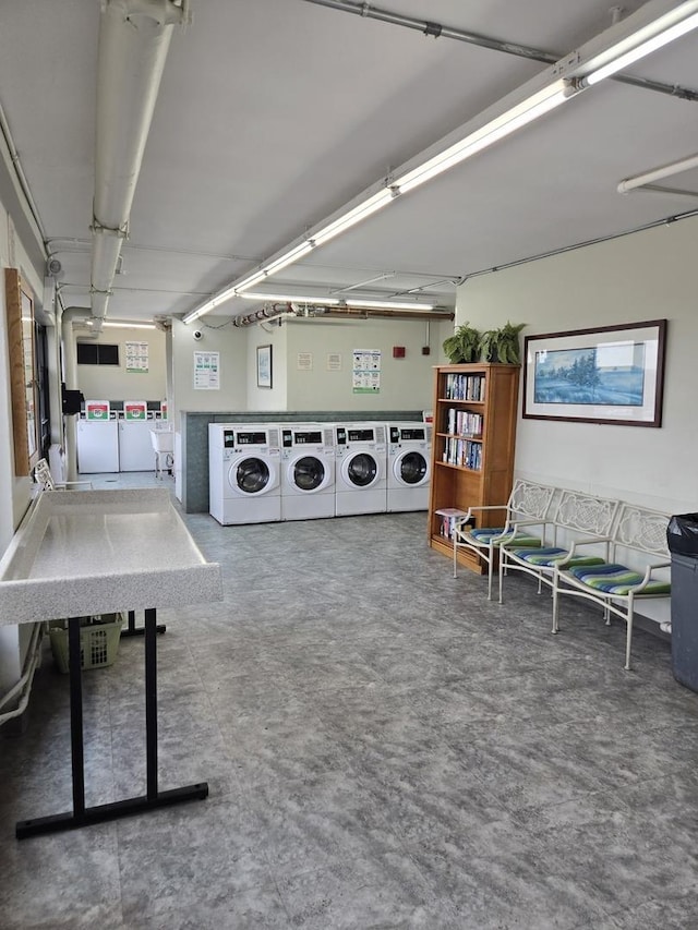 6700 S S Shore Dr Unit 2G, Chicago, IL 60649 - playroom with washing machine and dryer and concrete floors