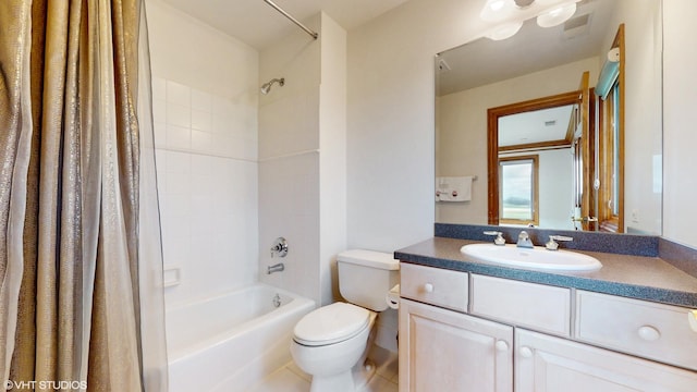 bathroom with shower / tub combo with curtain, toilet, and vanity