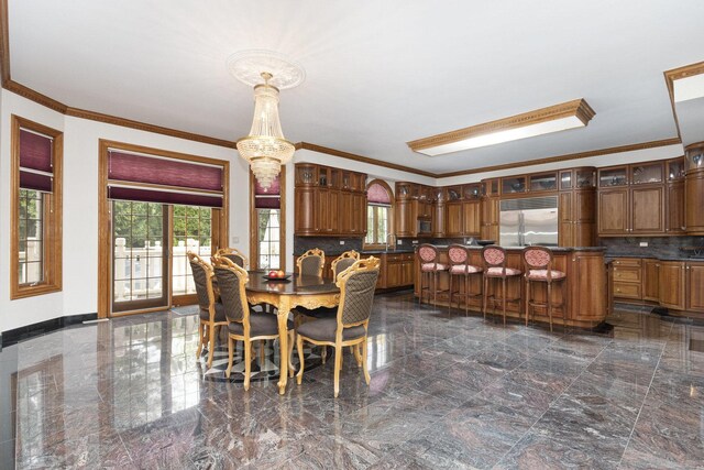 1020 Evergreen Dr, Lake Forest, IL 60045 - dining room featuring ornamental molding, dark marble finish floors, baseboards, and a chandelier
