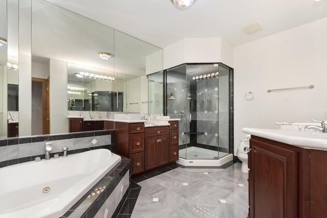 1020 Evergreen Dr, Lake Forest, IL 60045 - full bathroom with two vanities, a stall shower, a tub with jets, and toilet