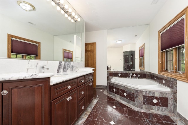 1020 Evergreen Dr, Lake Forest, IL 60045 - bathroom featuring marble tiled flooring, a garden tub, double vanity, and baseboards