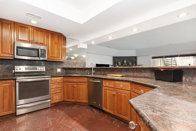 1020 Evergreen Dr, Lake Forest, IL 60045 - kitchen with stainless steel appliances, dark marble finish floors, brown cabinets, recessed lighting, and decorative backsplash