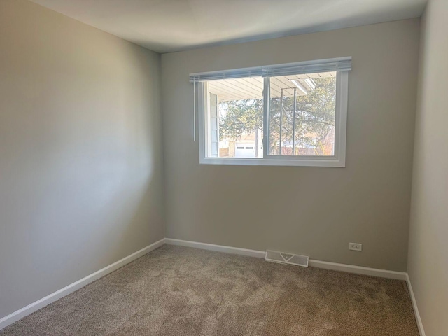 278 Rouse Ave, Mundelein, IL 60060 - empty room featuring carpet floors, baseboards, and visible vents