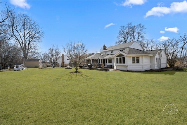 73 Brandon Ave, Glen Ellyn, IL 60137 - rear view of property with a yard