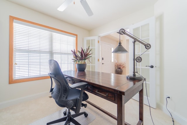 office with baseboards, light carpet, a ceiling fan, and a wealth of natural light