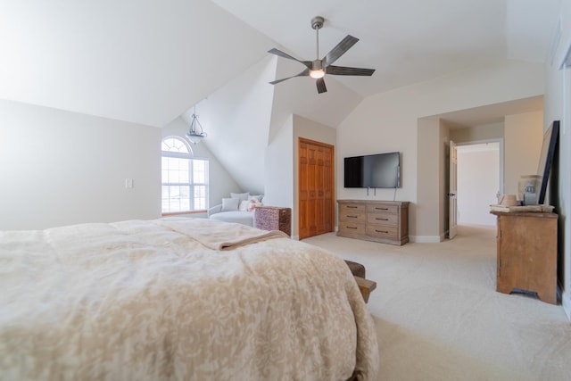 bedroom with baseboards, lofted ceiling, ceiling fan, and light carpet