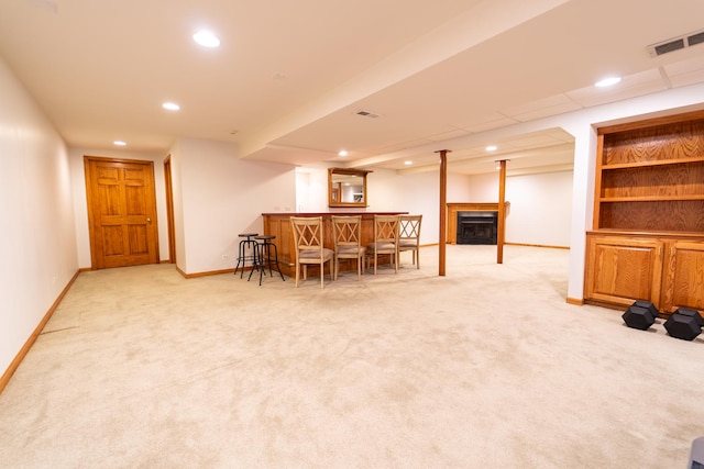 interior space with carpet floors, visible vents, and recessed lighting