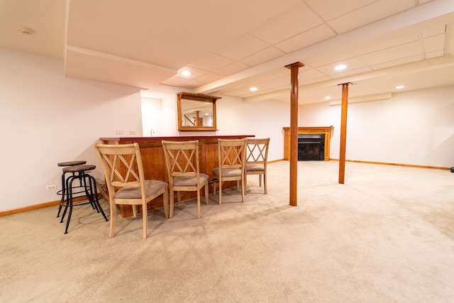 bar featuring a dry bar, a fireplace, baseboards, carpet flooring, and recessed lighting