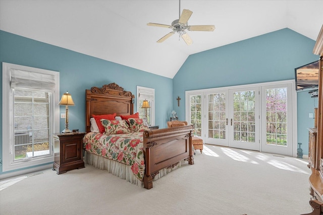 bedroom with lofted ceiling, access to exterior, multiple windows, french doors, and carpet