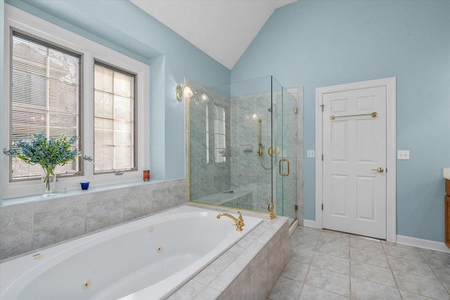 full bath featuring tile patterned flooring, baseboards, a tub with jets, vaulted ceiling, and a stall shower