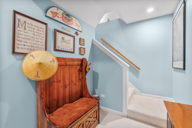 staircase with carpet floors and baseboards