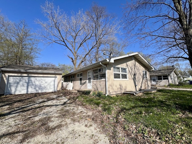1101 N Coler Ave, Urbana, IL 61801 - ranch-style house featuring an outdoor structure and a garage