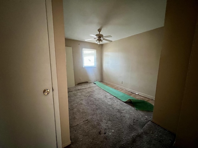 1101 N Coler Ave, Urbana, IL 61801 - carpeted empty room with a ceiling fan and baseboards
