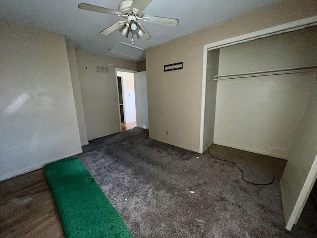 1101 N Coler Ave, Urbana, IL 61801 - unfurnished bedroom featuring carpet, a closet, and a ceiling fan