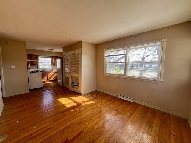 1101 N Coler Ave, Urbana, IL 61801 - unfurnished living room featuring dark wood finished floors and baseboards