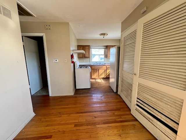 1101 N Coler Ave, Urbana, IL 61801 - corridor with dark wood finished floors and baseboards