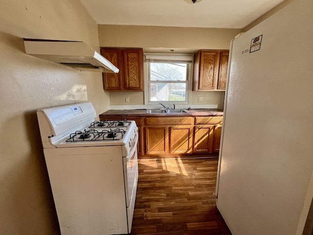 1101 N Coler Ave, Urbana, IL 61801 - kitchen with white appliances, a sink, dark wood finished floors, and brown cabinetry