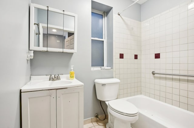 full bath featuring vanity, toilet, baseboards, tub / shower combination, and tile patterned floors