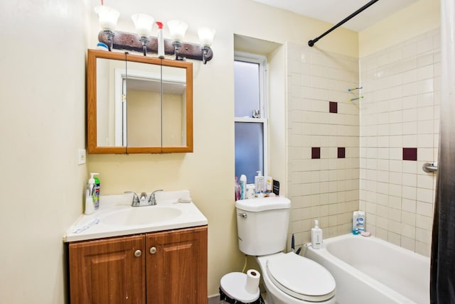 full bathroom featuring toilet, vanity, and  shower combination