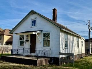 336 4th St, Lasalle, IL 61301 - rear view of property with a fenced front yard and a chimney