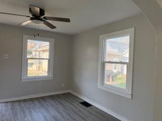 336 4th St, Lasalle, IL 61301 - unfurnished room featuring arched walkways, baseboards, and a healthy amount of sunlight