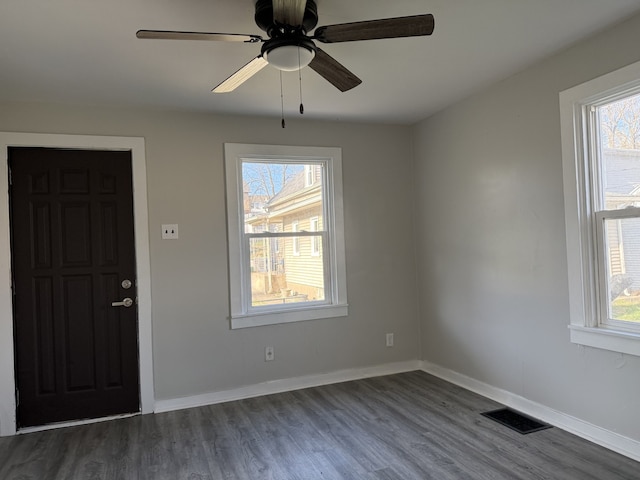 336 4th St, Lasalle, IL 61301 - entryway featuring baseboards, visible vents, dark wood-type flooring, and a ceiling fan