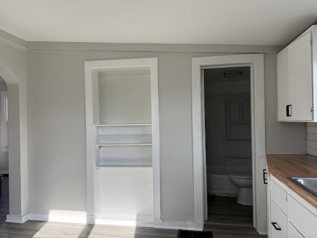 336 4th St, Lasalle, IL 61301 - interior space with toilet, wood finished floors, baseboards, and vanity