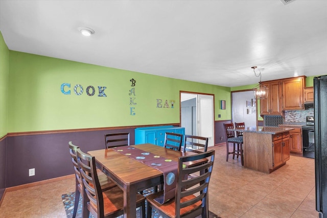dining space with light tile patterned floors