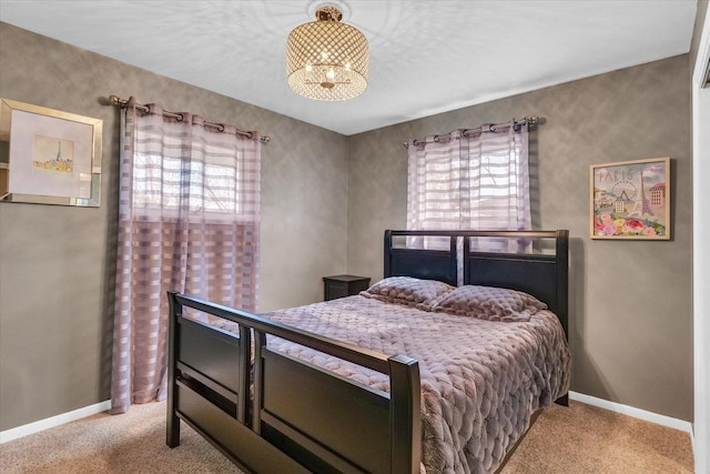 carpeted bedroom with baseboards