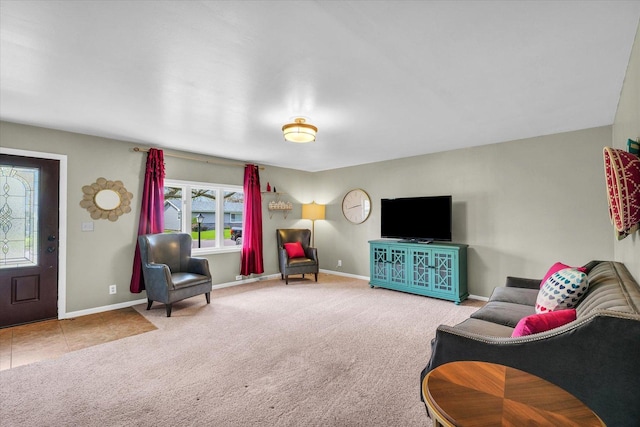 living room with carpet and baseboards