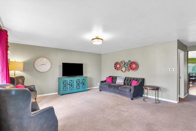 living room with carpet flooring and baseboards