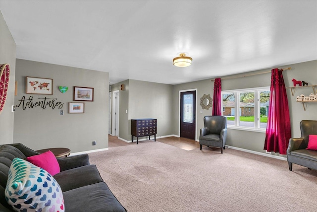 living room with carpet and baseboards