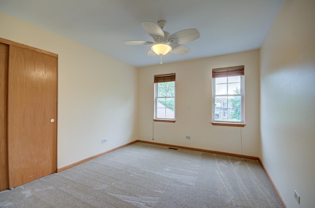 5615 Cider Grove Ct, Plainfield, IL 60586 - carpeted empty room with baseboards and a ceiling fan