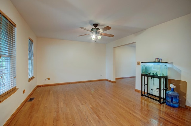 5615 Cider Grove Ct, Plainfield, IL 60586 - empty room with light wood finished floors, a ceiling fan, and baseboards
