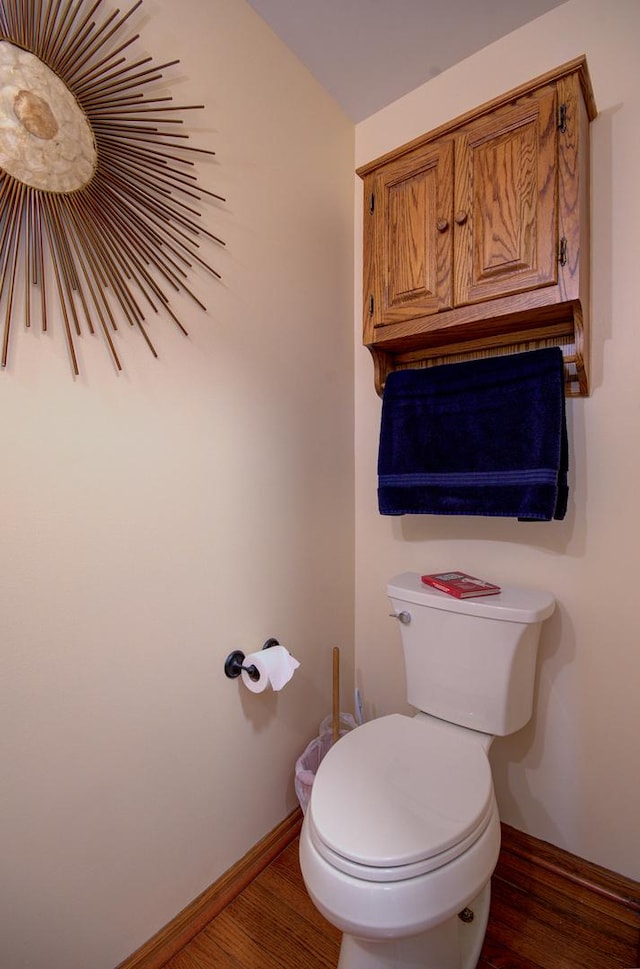 5615 Cider Grove Ct, Plainfield, IL 60586 - bathroom with wood finished floors, toilet, and baseboards