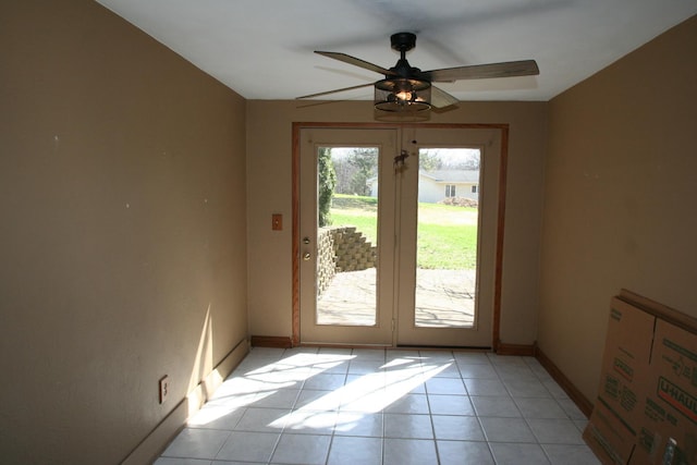 801 Heritage Dr, Mackinaw, IL 61755 - doorway to outside featuring baseboards, ceiling fan, and light tile patterned floors