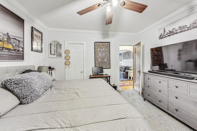 bedroom with a ceiling fan and crown molding